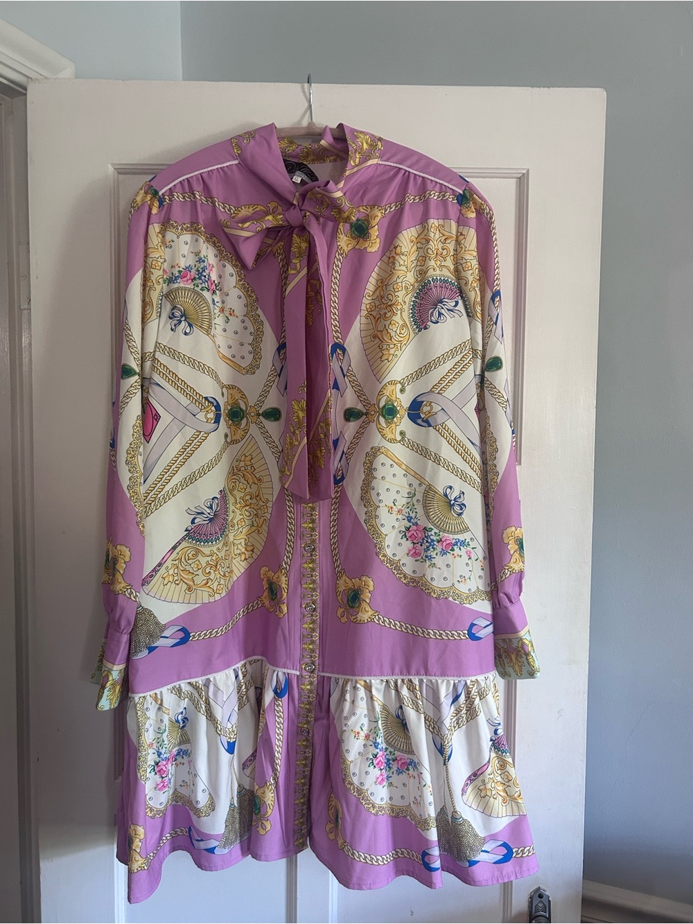 Dalia MacPhee long sleeve mini dress with neck tie and a ruffled hem